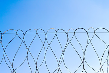 barbed wire against the sky
