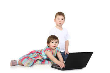 brother and the sister look cartoon films on a laptop