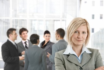 Fototapeta premium Smiling businesswoman in office lobby