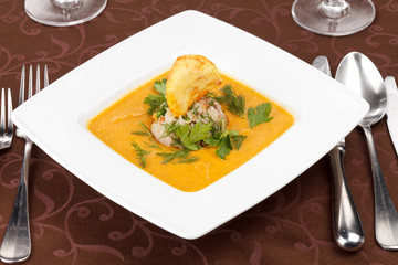 cream soup with rice and potato chips