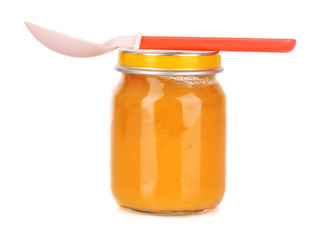 food for children and spoon on white background