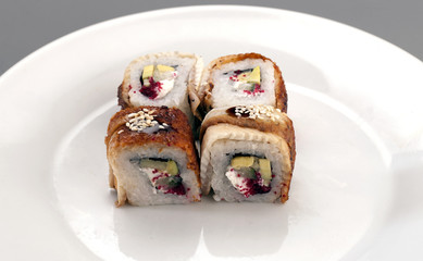four appetizer sushi with eel