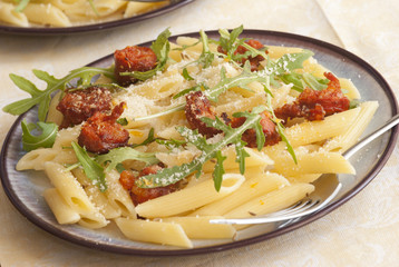 Pasta Penne with chorizo, rocket and cheese