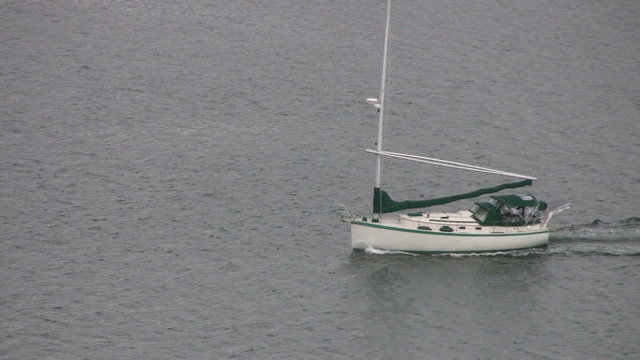 Sailboat Pulling A Dingy