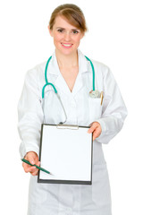 Smiling  doctor woman with documents and pen for your signature