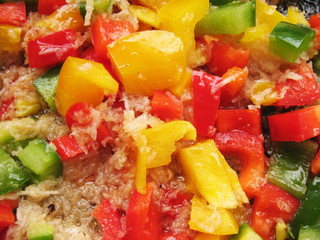 Yellow, red and green Bulgarian pepper in skillet.