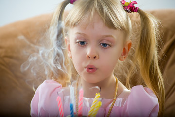 Blowing on a birthday candle