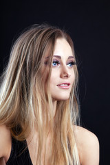 Naklejka premium Young amazing blond girl look at light
