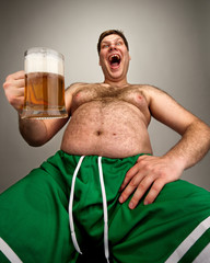 Funny fat man with glass of beer
