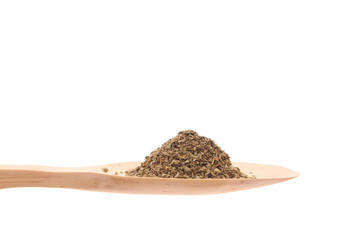 Oregano on a wooden spoon isolated on a white background