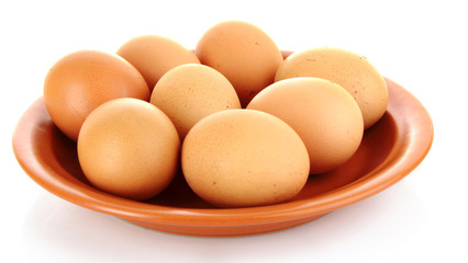 Eggs in plate isolated on white