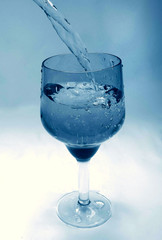 glass goblet in which the water flowing