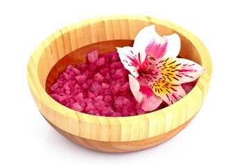 Flower and bath salt on white background