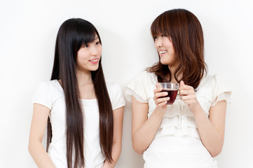 two beautiful asian women relaxing