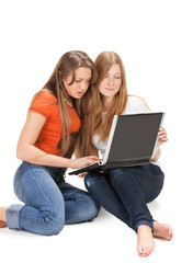 two young happy student girl work on laptop