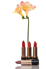 glamor red shiny lipstick and yellow flower