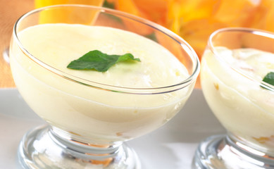 Cream cheese dessert garnished with mint leaf