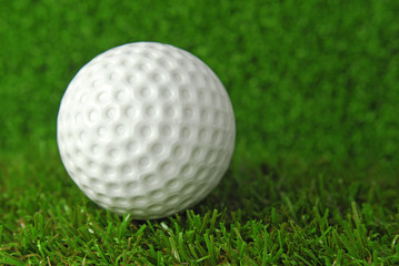 golf ball on the green grass turf