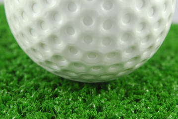 golf ball on the green grass turf