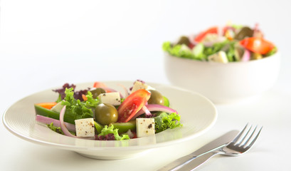 Greek salad on white background