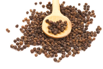 Black Peppercorns on a wooden spoon