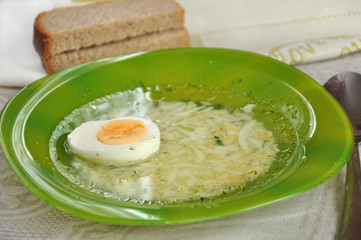 Chicken broth with egg and dill