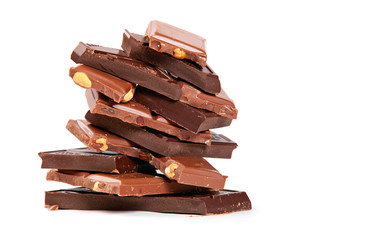 Stacked pieces of dark and milk chocolate over white