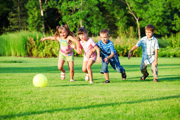 Kids group playing with ball