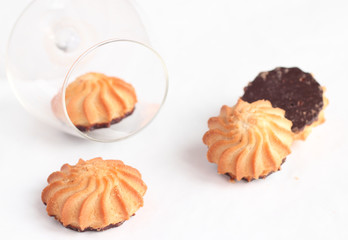 Cookies with chocolate and a .cognac glass
