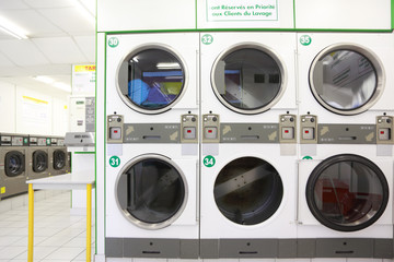 Fototapeta premium number of washing machines in empty public laundry