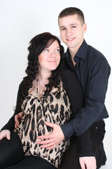 Happy man embrace pregnant woman