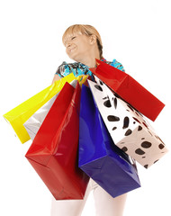 Woman holding shopping bags against a white background