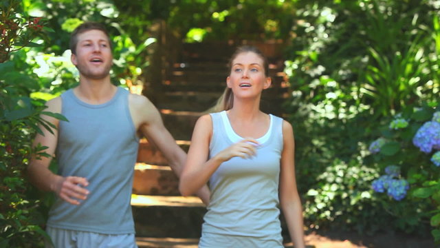 Couple running in the wood