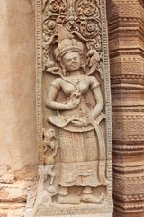 Fototapeta na wymiar Sandstone carving at Prasat Sikhoraphum Sanctuary, Surin