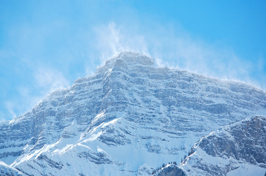 Snow spindrift on mountain peak 05