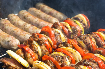 Shashlik and white sausage on the grill