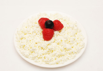 cottage cheese with berries red ripe strawberries on the plate w