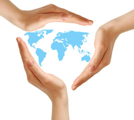 female hands surrounding the world map on white