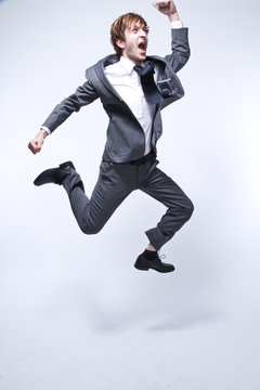 young businessman jumping