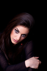 Young woman, on black background