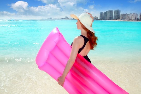 floating lounge pink girl in caribbean tropical beach