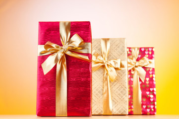 Celebration concept - Gift box against colorful background