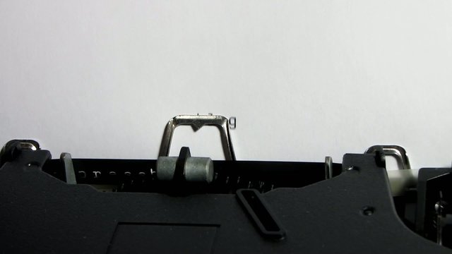 Typewriter closeup writing "blog" on white paper