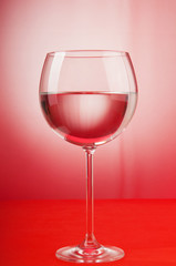 Water in the glass against gradient background