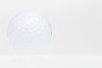 Golf ball with reflections on a white background