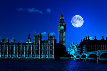 Night scene in London showing the Big Ben and a bright moon