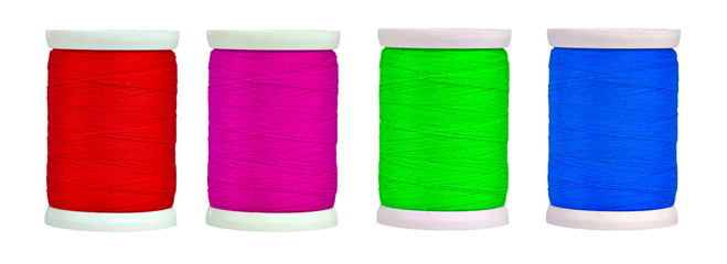 Colorful reels with thread isolated on a white background