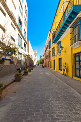 Typical street in Old Havana surrounded by ancient  buildings