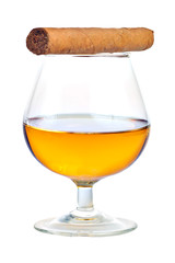 Glass of cognac  with a cuban cigar isolated on white