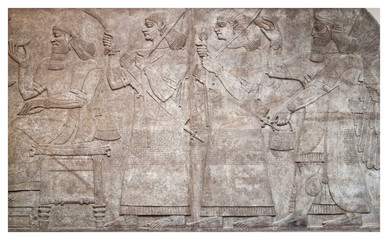 Ancient relief of assyrian winged gods and archers